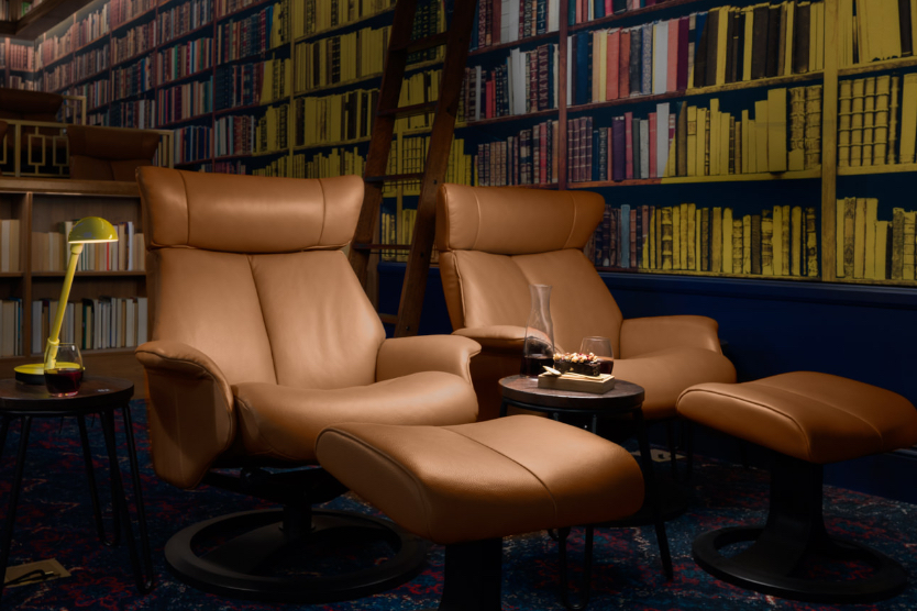 Art-house cinema interior with ornate ceiling and warm amber lighting